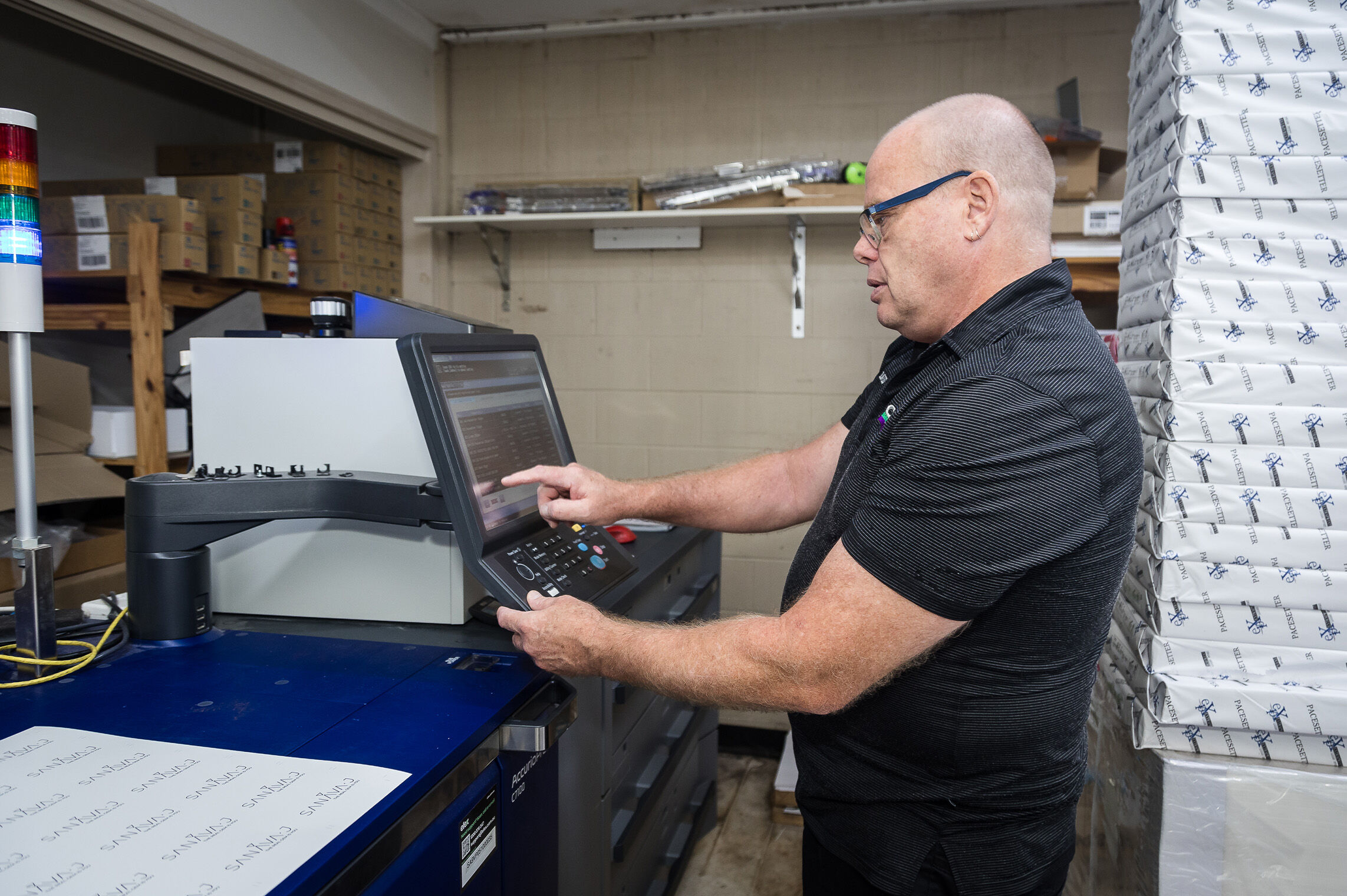 Cardzilla Staff Member using Konica Minolta Printer